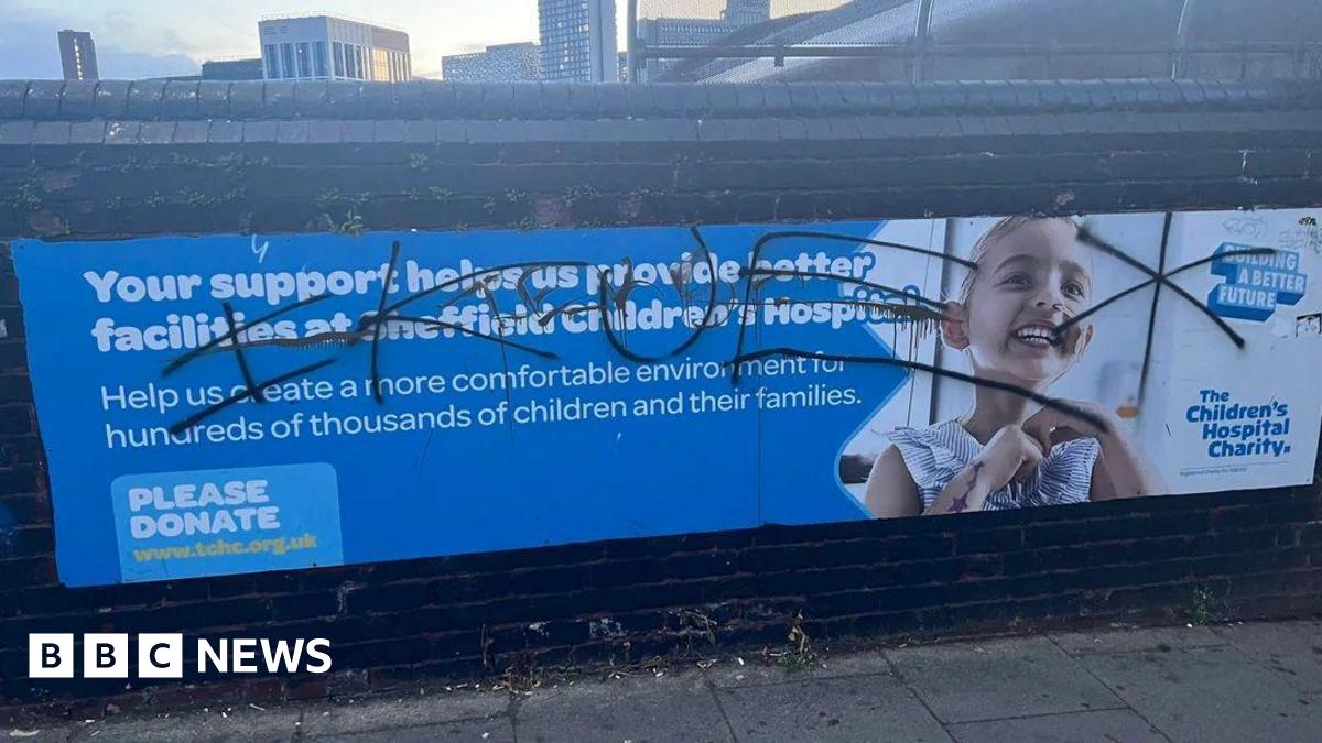A billboard for the Sheffield Children's Hospital Charity which reads: "Yours support helps us provide better facilities at the hospital." However, a graffiti tag has been sprayed across the entire sign, including a photo of a little girl using a breathing tube.