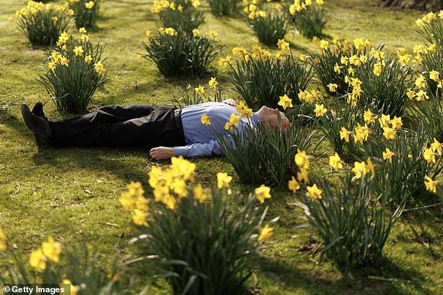 A man taking a break in the sunshine in St James's Park, London, on March 20, which is the spring equinox