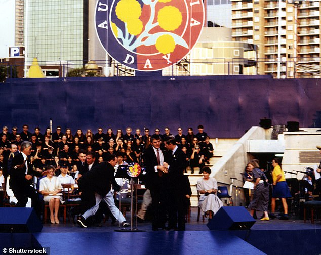 The then-Prince Charles moments after 23-year-old David Kang shot a starting pistol at him during Australia Day celebration in Sydney in 1994