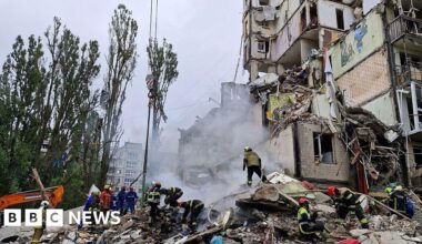Russian strikes kill eight and hit apartment block in Kyiv, officials say