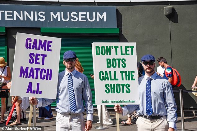 Two students dressed as line judges protested against the use of AI at Wimbledon on Monday