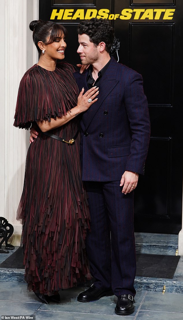 She placed a caring hand on her husband's chest