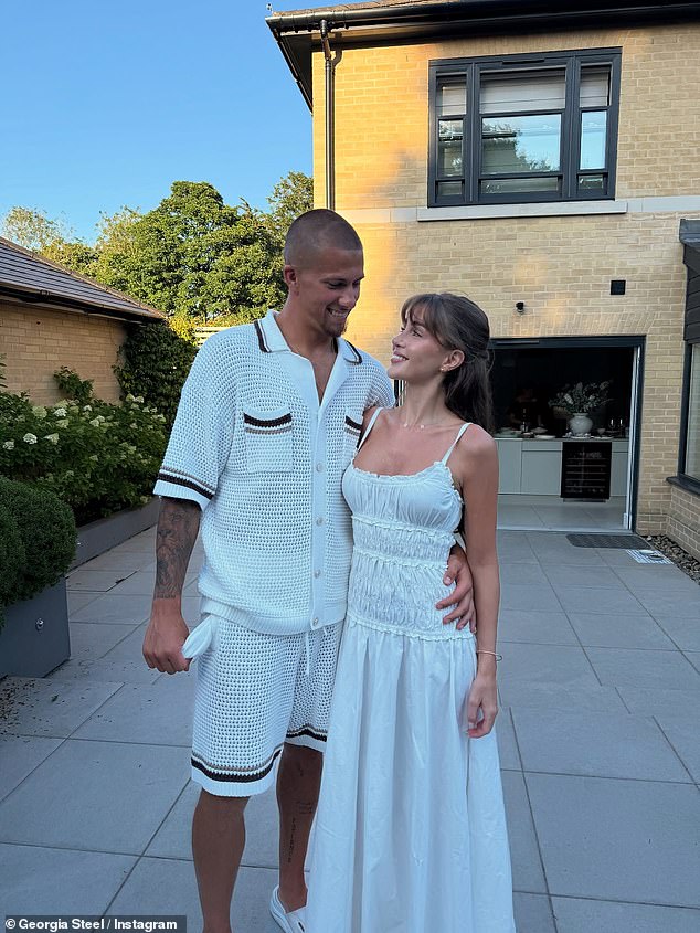 Dressed in a stunning white summer dress, she posted a carousel of photos celebrating her new qualification alongside her boyfriend Harry Clarke
