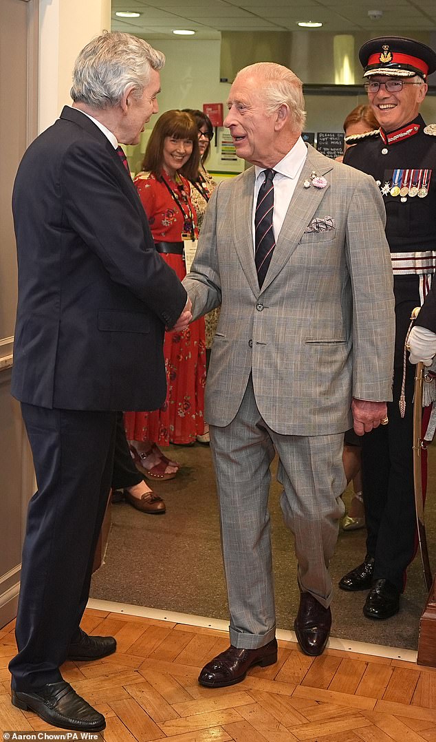 King Charles greeted former Prime Minister Gordon Brown during a visit to Kirkcaldy Art Gallery in Scotland today