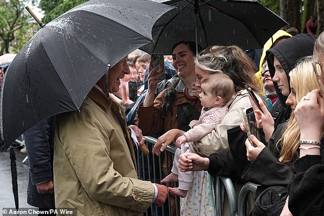 Charles shared a giggle with a young child during the visit to Kirkcaldy, Fife, as part of Holyrood Week
