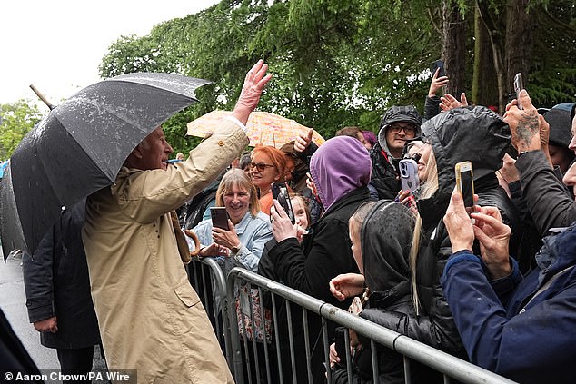 The rain didn't deter members of the public from queuing up to catch a glimpse of the royals during their trip