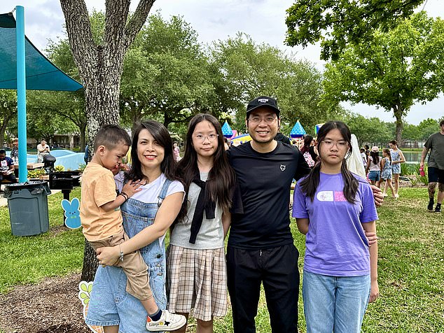 Nguyen (second from right) is pictured above with his two 11-year-old daughters (far right and center), wife (second from left) and son (far left). The family moved to the US from Vietnam while Nguyen completes his public health studies