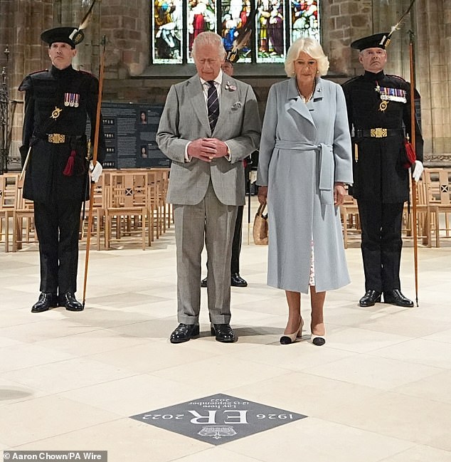 King Charles and Queen Camilla unveil a memorial stone in St Giles Cathedral in Edinburgh, where Queen Elizabeth II lay at rest before being carried to London, as part of their trip to Scotland for Holyrood Week