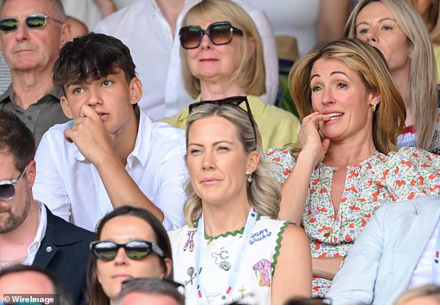 A nervous-looking Cat sat alongside Ben Shephard's son Jack, 18
