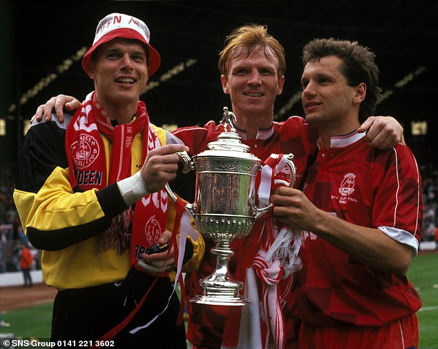 Gillhaus (right) celebrates Aberdeen's 1990 Scottish Cup win with Snelders and McLeish