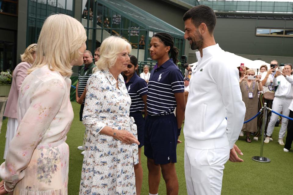 london, england july 9: queen camilla (c) speaks with novak djokovic (r) at the all england lawn tennis and croquet club on day ten of the 2025 wimbledon championships on july 9, 2025 in london, england. (photo by jordan pettitt wpa pool/getty images)