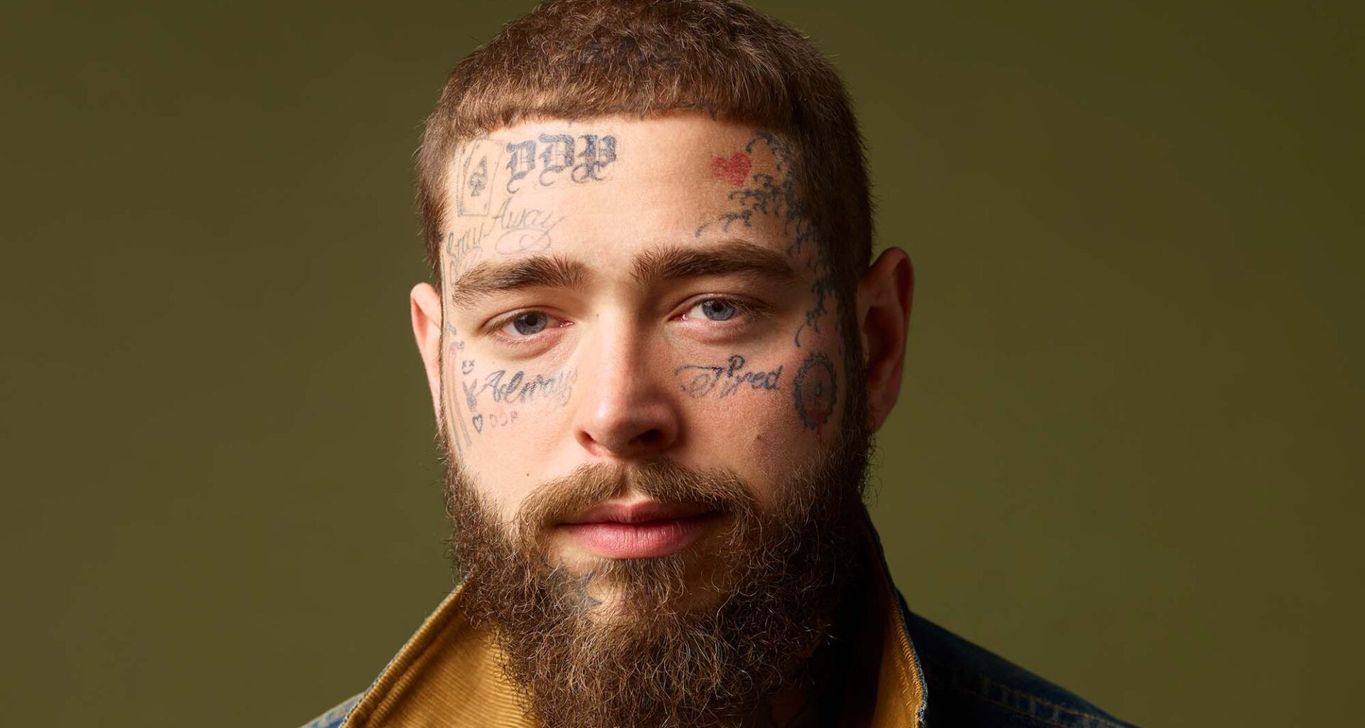 Post Malone falls off stage while toasting a fan on front row