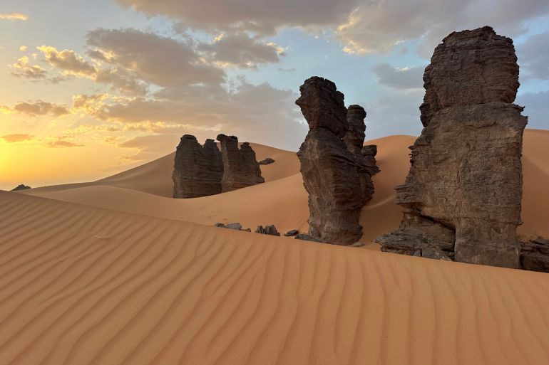 Rock formations stand in the Sahara desert outside the city center of Djanet, a southeastern Algerian oasis town in the Sahara desert,