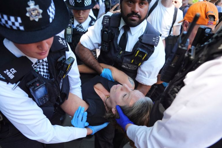 Police arrest protester.  