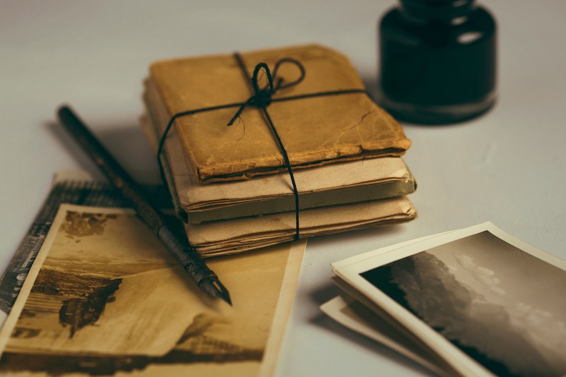 A weathered pack of letters and a pen