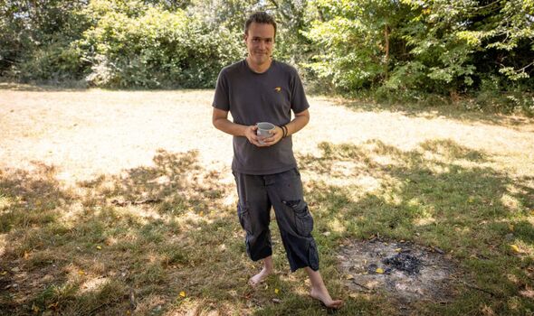 Craig Collier pictured on the Downs holding a mug
