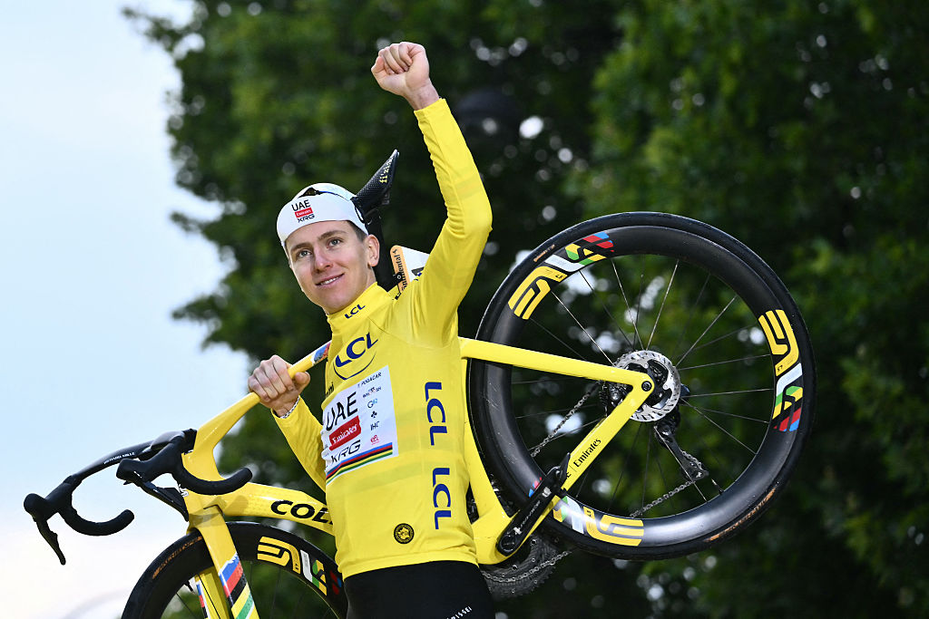 UAE Team Emirates - XRG team's Slovenian rider Tadej Pogacar celebrates on the podium with the overall leader's yellow jersey after the 21st and final stage of the 112th edition of the Tour de France cycling race, 132.3 km between Mantes-la-Ville and Paris Champs-Ã‰lysees, on July 27, 2025. (Photo by Marco BERTORELLO / AFP)