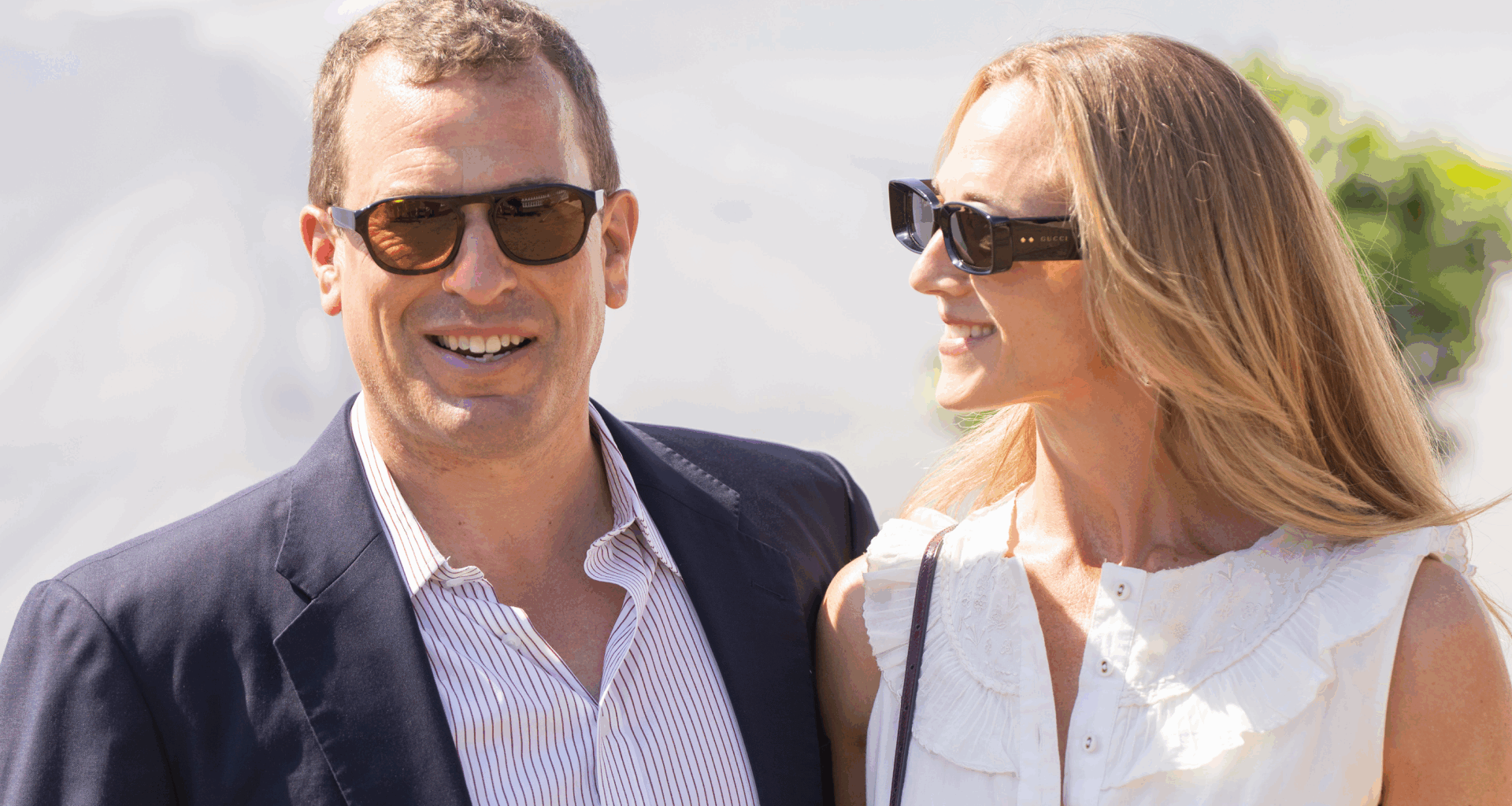 Peter Phillips and Harriet Sperling wearing sunglasses and smiling