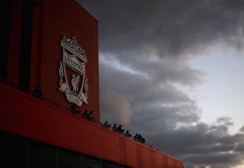 Liverpool's Anfield stadium seen from outside with dark clouds in background