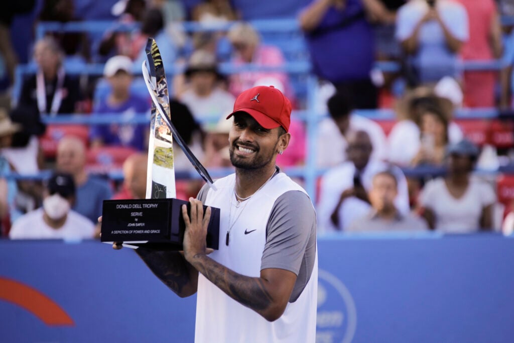 Nick Kyrgios, from Australia, holds the Donald Dell Trophy after winning the ATP finals at the Citi Open.
