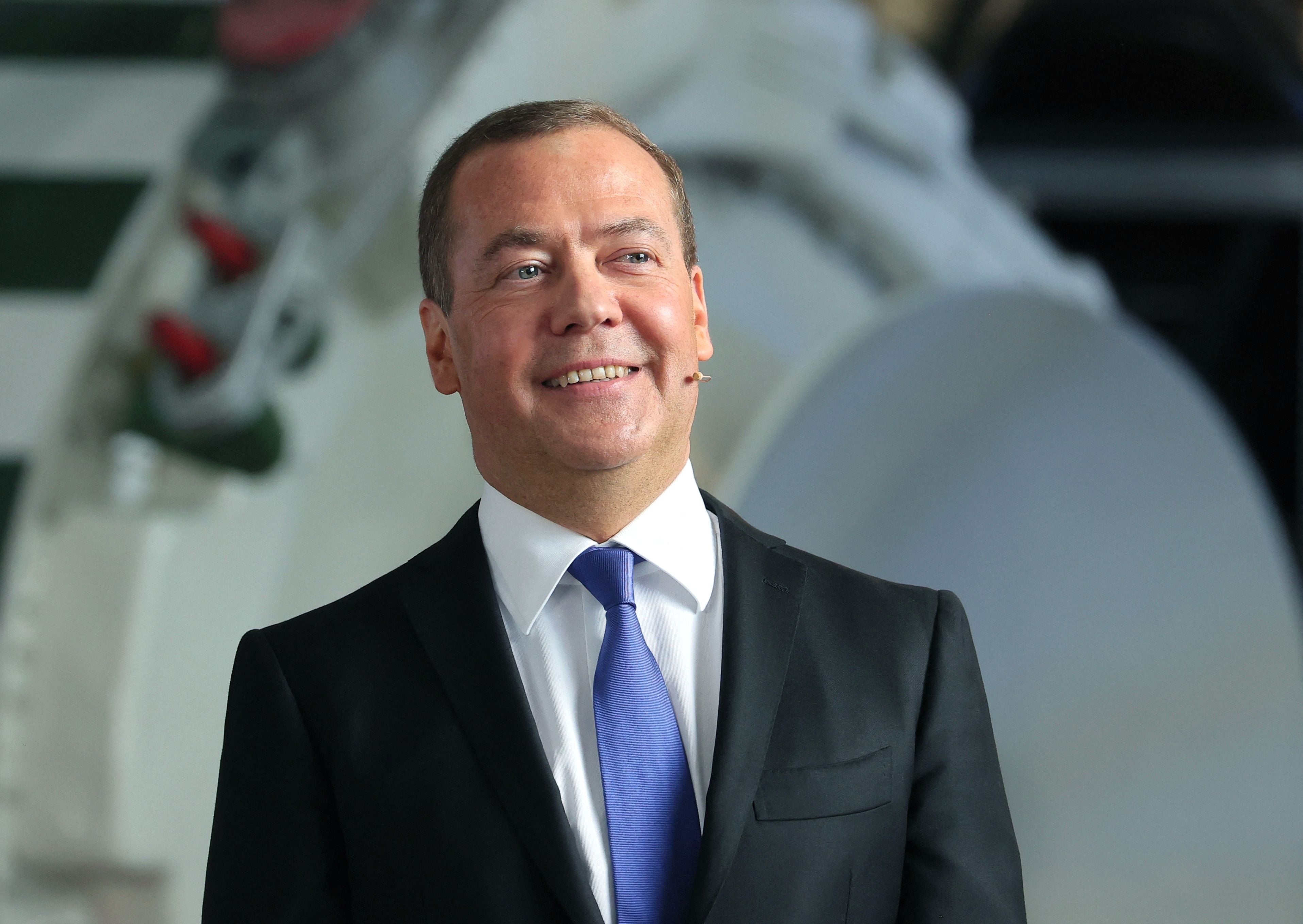 Russia's former leader and deputy chairman of the country's security council Dmitry Medvedev meets with staff members during his visit to the military-industrial corporation NPO Mashinostroyenia in Reutov outside Moscow
