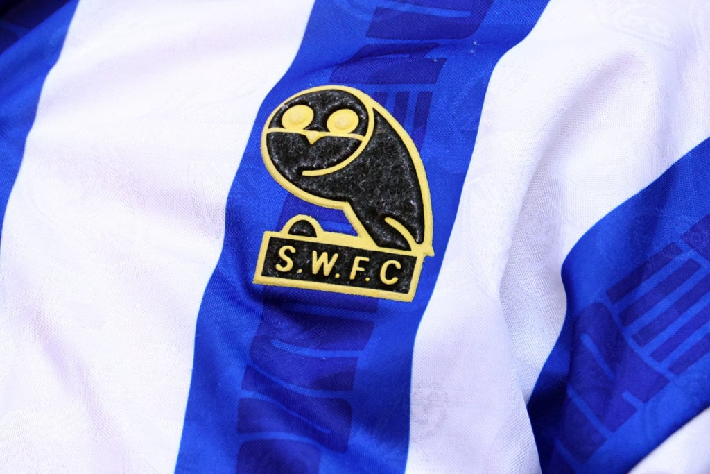The old Sheffield Wednesday badge, worn by a fan during Barnsley v Sheffield Wednesday: Sky Bet League One Play-Off Final