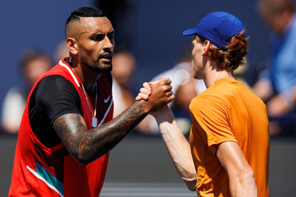 Nick Kyrgios and Jannik Sinner shake hands after their match at the 2022 Miami Open