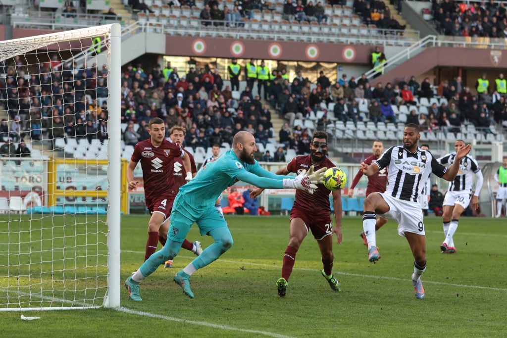 Vanja Milinkovic-Savic of Torino FC grabs the ball from the toe of Beto of Udinese Calcio during the Serie A match between Torino FC and Udinese Calcio at Stadio Olimpico di Torino on February 05, 2023.