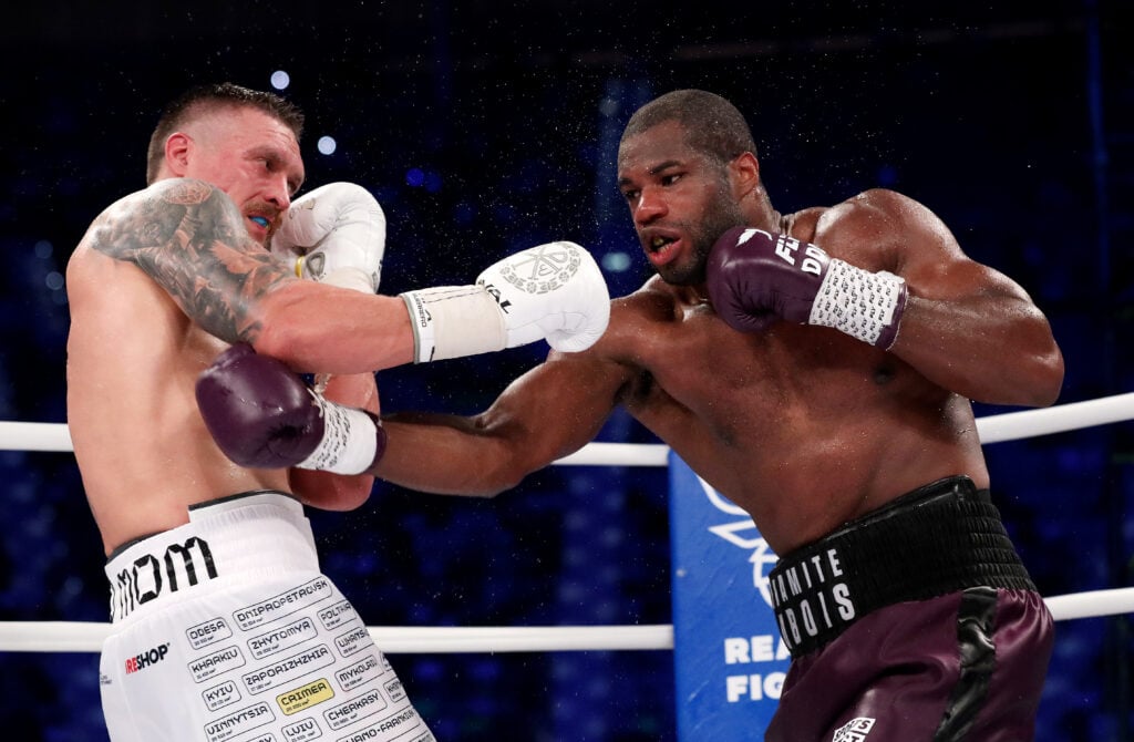Daniel Dubois throws a right hook towards Oleksandr Usyk during their 2023 fight