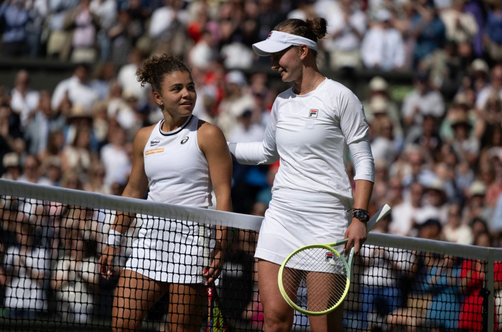 Barbora Krejcikova and Jasmine Paolini meet at the net after the 2025 Wimbledon final