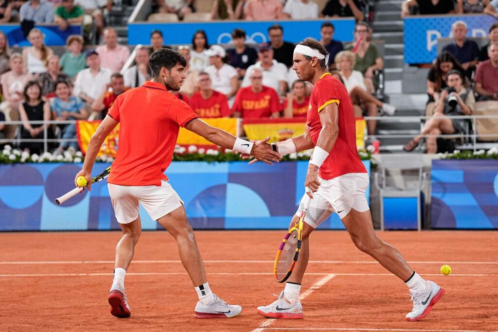 Nadal and Alcaraz shake hands during a doubles match at the 2024 Olympic Games in Paris