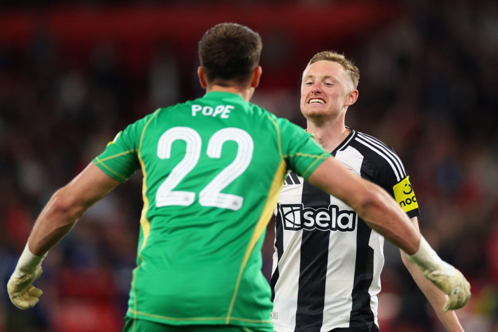Nick Pope and Sean Longstaff of Newcastle United