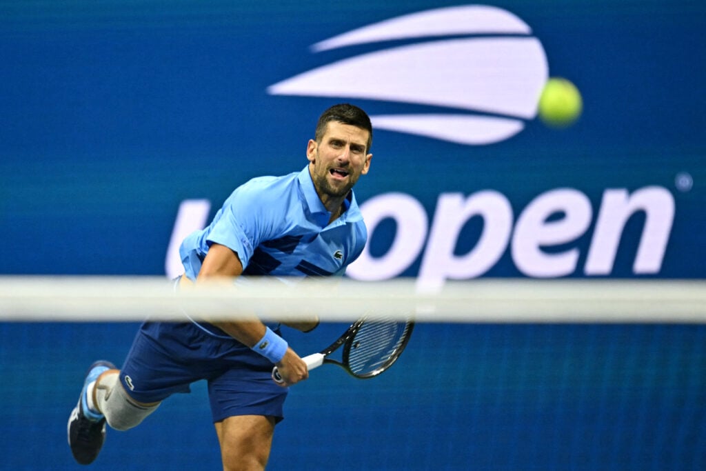 Novak Djokovic serves at the 2025 US Open in New York