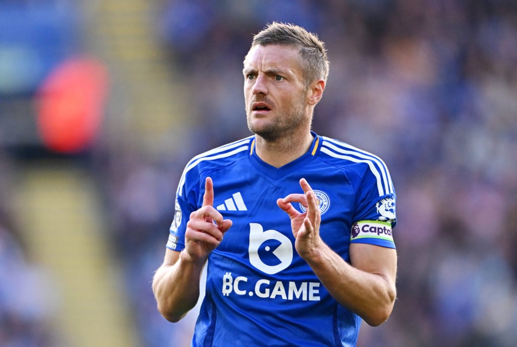 Jamie Vardy gives instructions to a Leicester City teammate during a Premier League game