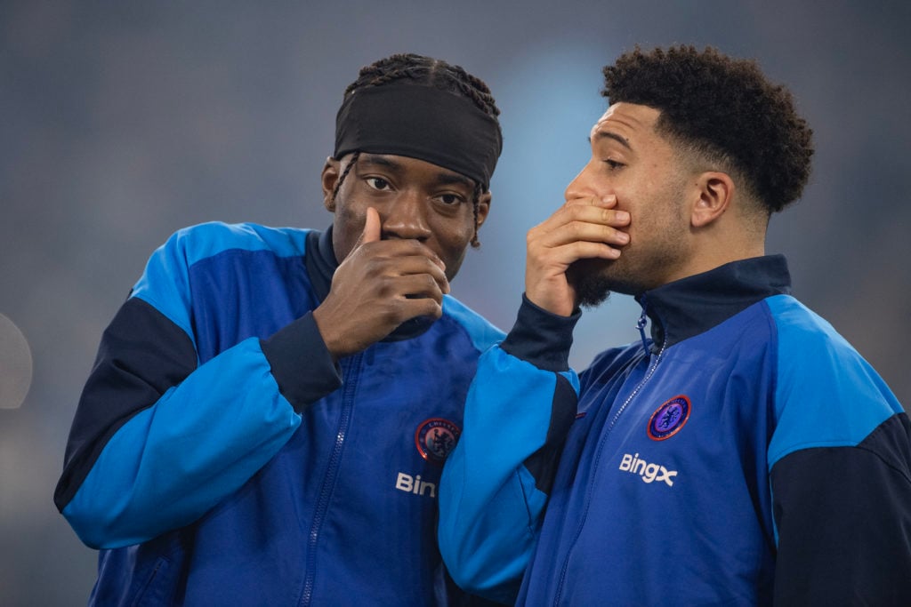 Noni Madueke interacts with Manchester United winger Jadon Sancho at Chelsea during the Premier League match against Manchester City at the Etihad Stadium in 2025 in Manchester.