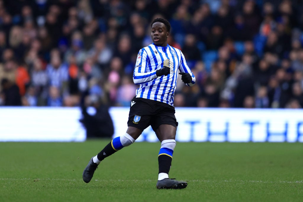 Djeidi Gassama of Sheffield Wednesday looks on