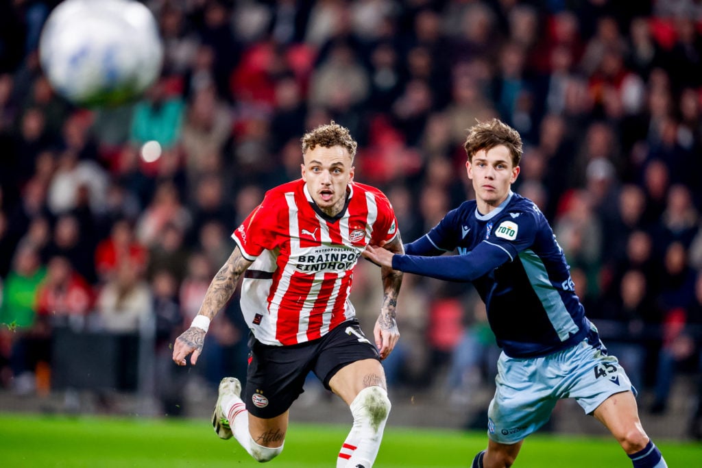 Noa Lang of PSV battles for the ball with Oliver Braude of Heerenveen during the Dutch Eredivisie match between PSV and Heerenveen at Philips Stadion on March 8, 2025