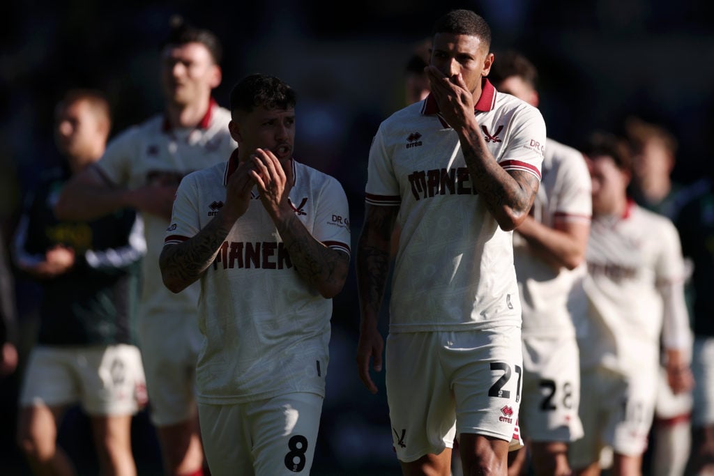 Gustavo Hamer and Vinicius Souza look dejected after Sheffield United lose against Oxford United