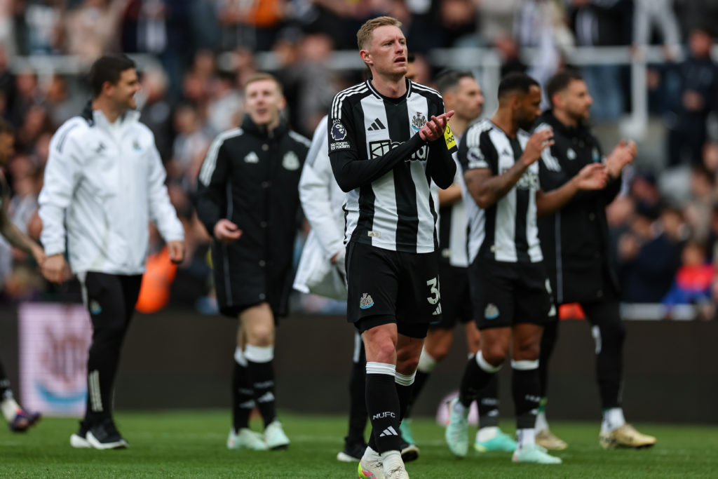 Sean Longstaff applauds the Newcastle United fans after beating Manchester United.