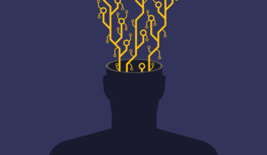 An image of a faceless human silhouette (chest up) with exposed microchip contacts and circuitry erupting from its open head. This visual metaphor explores transhumanism, AI integration, or the erosion of organic thought in the digital age. The stark contrast between the biological silhouette and mechanical components highlights themes of technological dependence or posthuman evolution. Ideal for articles on neural implants, futurism, or the ethics of human augmentation.