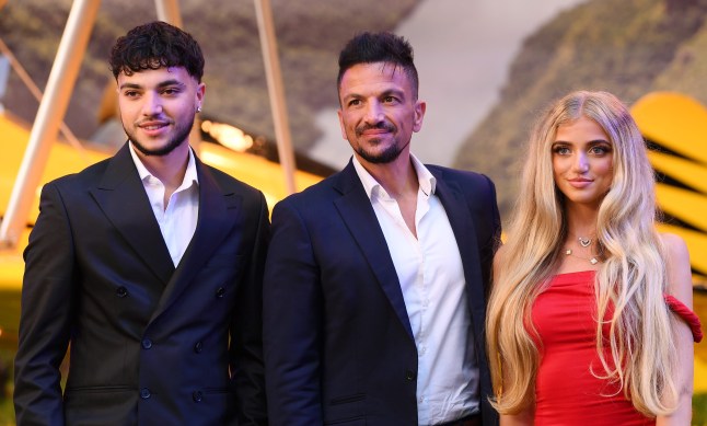 Junior, Peter Andre, and Princess wearing formal clothing posing together on the red carpet