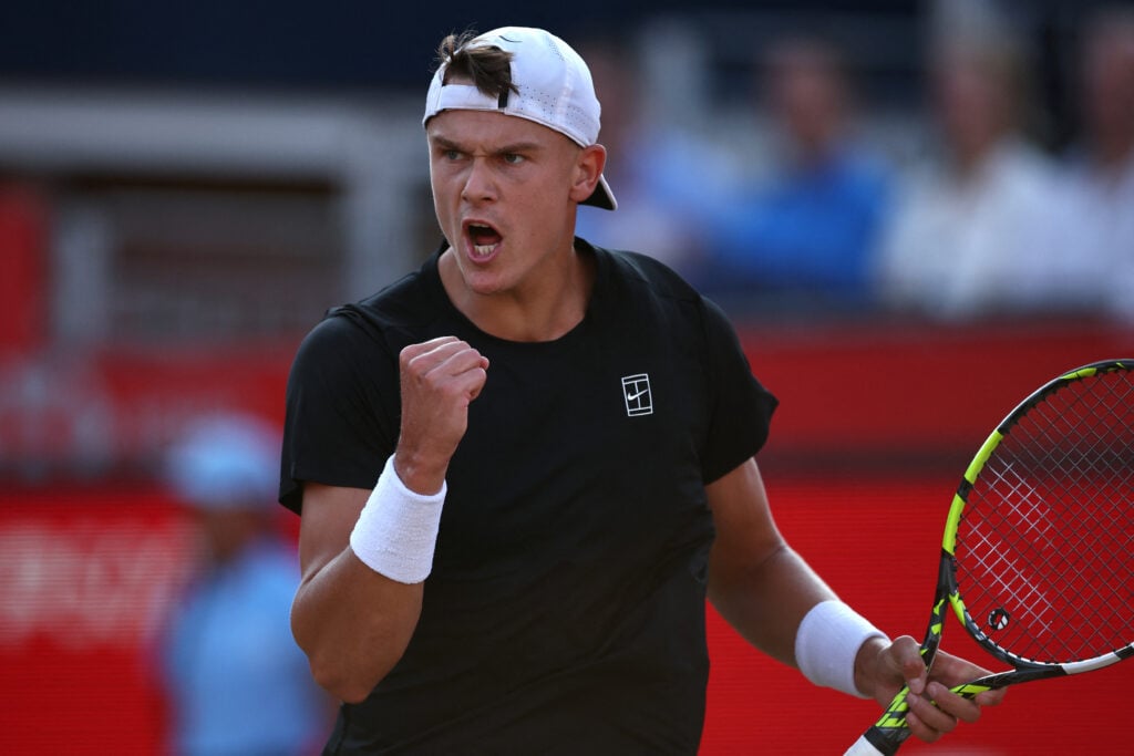 Holger Rune celebrates winning a point at Queen's in 2025