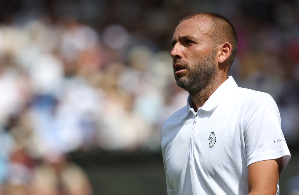 Dan Evans looks on during his match against Novak Djokovic at The Championships - Wimbledon 2025