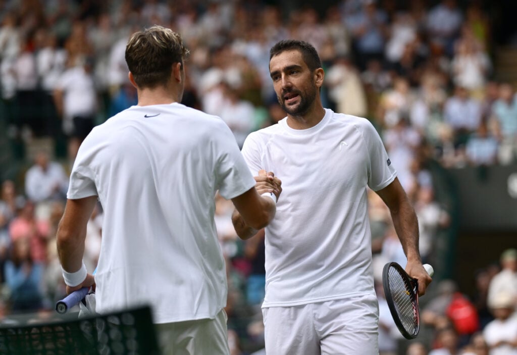 Marin Cilic and Jack Draper shake hands at Wimbledon in 2025.