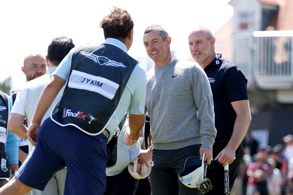 NORTH BERWICK, SCOTLAND - JULY 09: Rory McIlroy of Northern Ireland shakes hands with his group following their round during the pro-am prior to the Genesis Scottish Open 2025 at The Renaissance Club on July 09, 2025 in North Berwick, Scotland. (Photo by Christian Petersen/Getty Images)