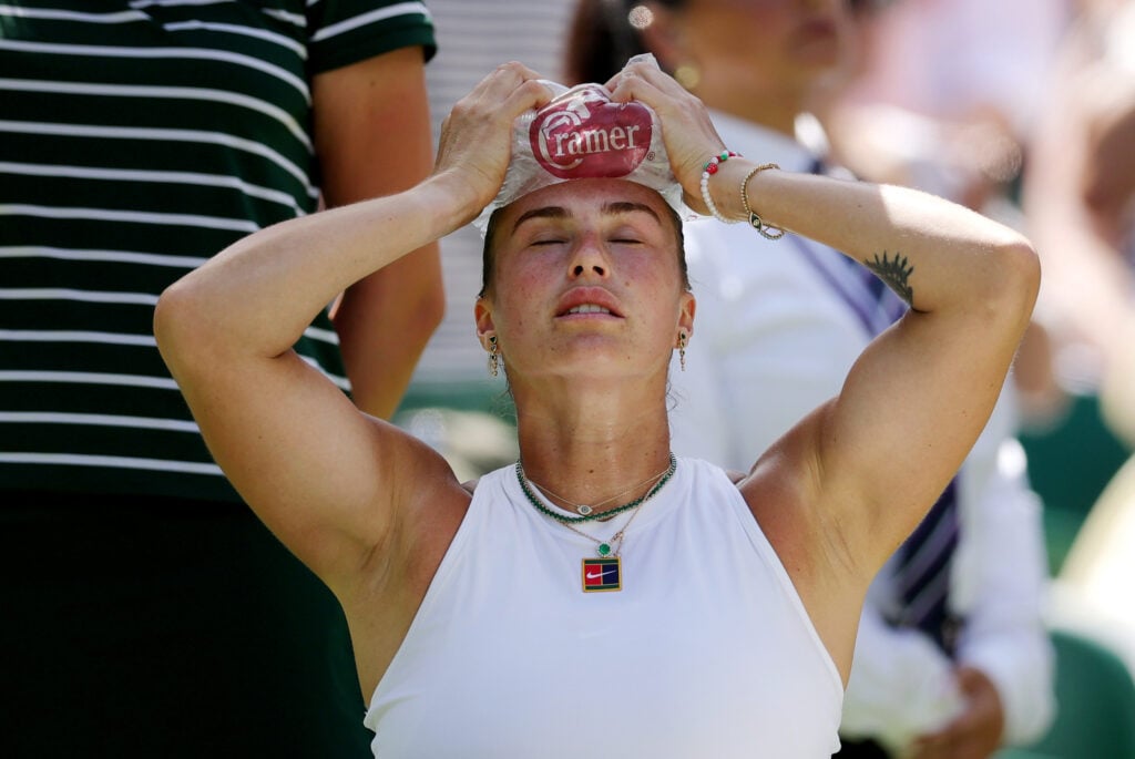 Aryna Sabalenka holds ice on her head during a change over against Amanda Anisimova of United States during the Ladies' Singles semi-final on day eleven of The Championships Wimbledon 2025 at All England Lawn Tennis and Croquet Club.