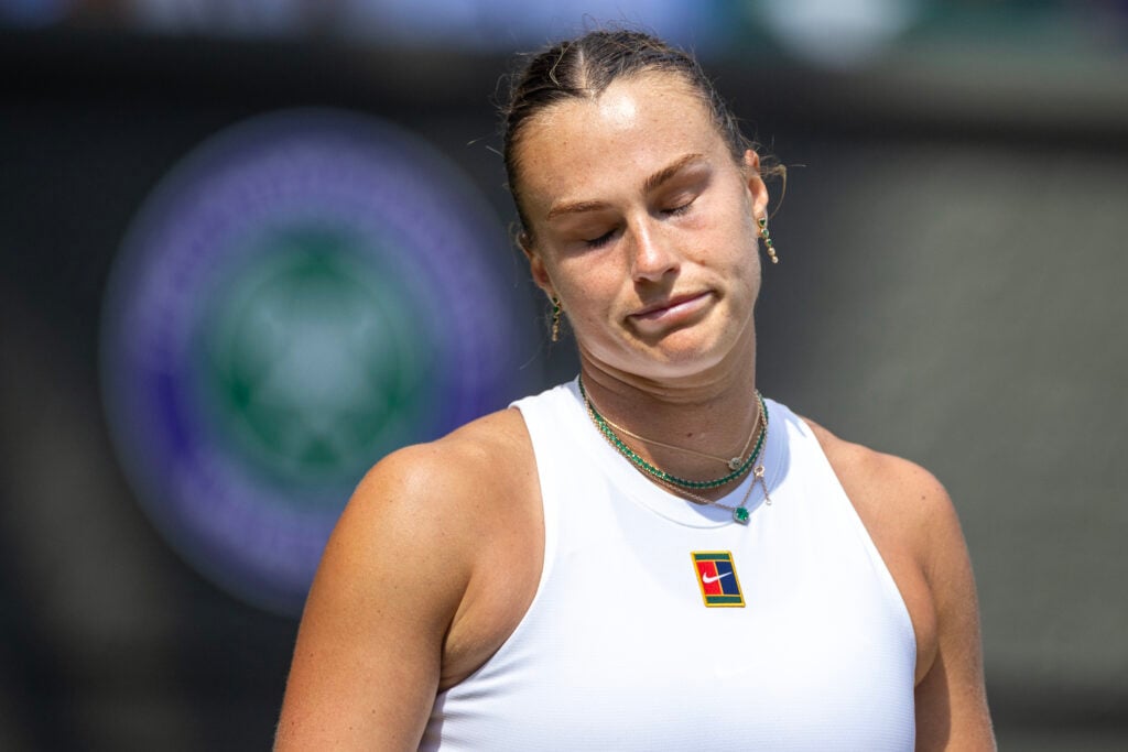 Aryna Sabalenka reacts during her defeat to Amanda Anisimova at Wimbledon in 2025