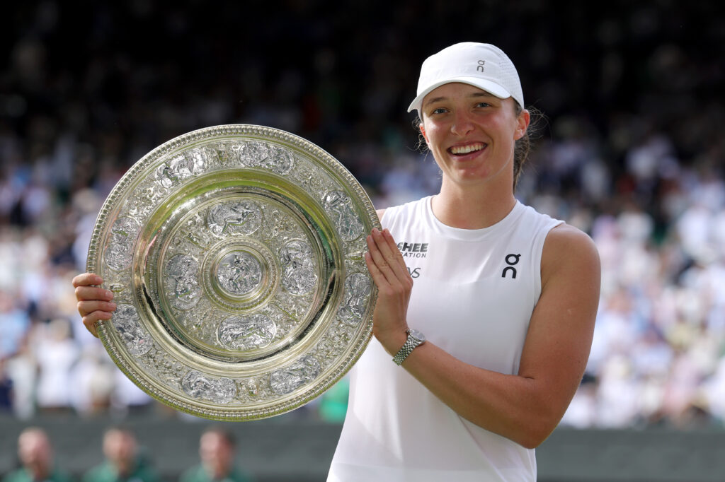 Iga Swiatek of Poland poses for a photo with the Ladies’ Singles Trophy following her victory against Amanda Anisimova of United States during the Ladies' Singles Final on day thirteen of The Championships Wimbledon 2025 at All England Lawn Tennis and Croquet Club on July 12, 2025 in London, England.