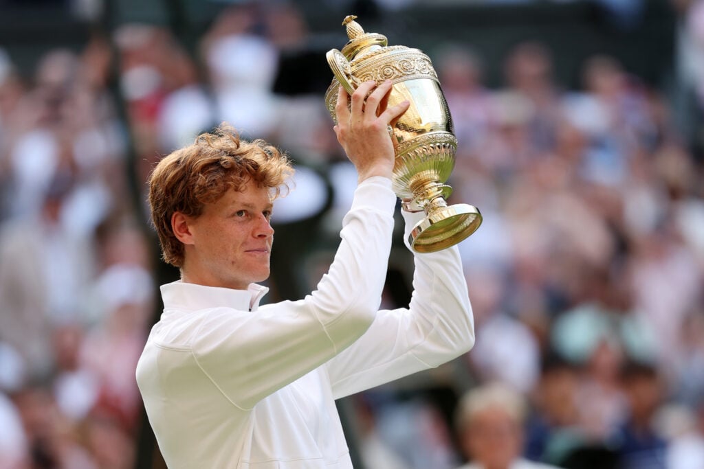 Jannik Sinner of Italy lifts the Gentlemen’s Singles Trophy following his victory against Carlos Alcaraz of Spain during the Gentlemen’s Singles Final on day fourteen of The Championships Wimbledon 2025.