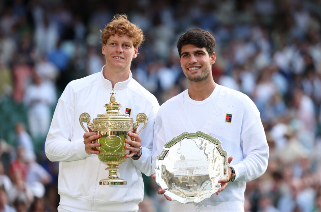 Jannik Sinner of Italy poses with the Gentlemen’s Singles Trophy alongside Carlos Alcaraz of Spain with the Gentlemen’s Singles Runner-Up Trophy after the Gentlemen’s Singles Final on day fourteen of The Championships Wimbledon 2025 at All England Lawn Tennis and Croquet Club on July 13, 2025 in London, England.